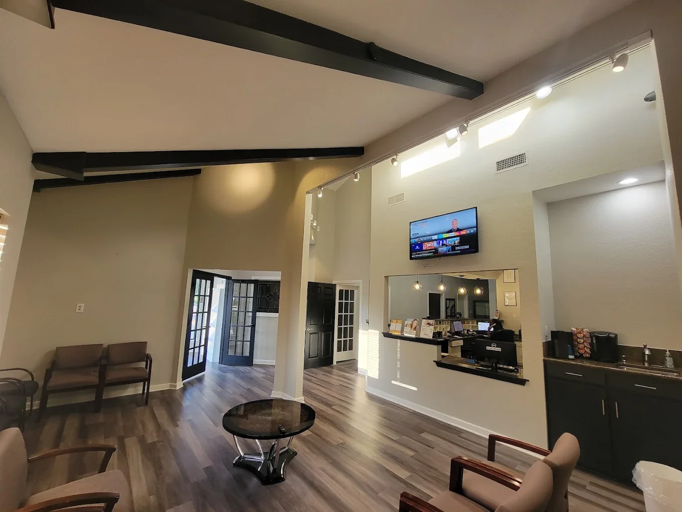 A lounge and reception seating area at Harwood Family Dental