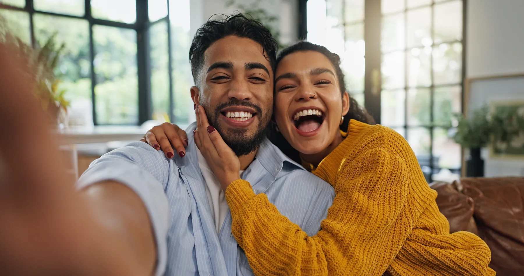 Smiling Couple Selfie Smiling couple taking a selfie at home