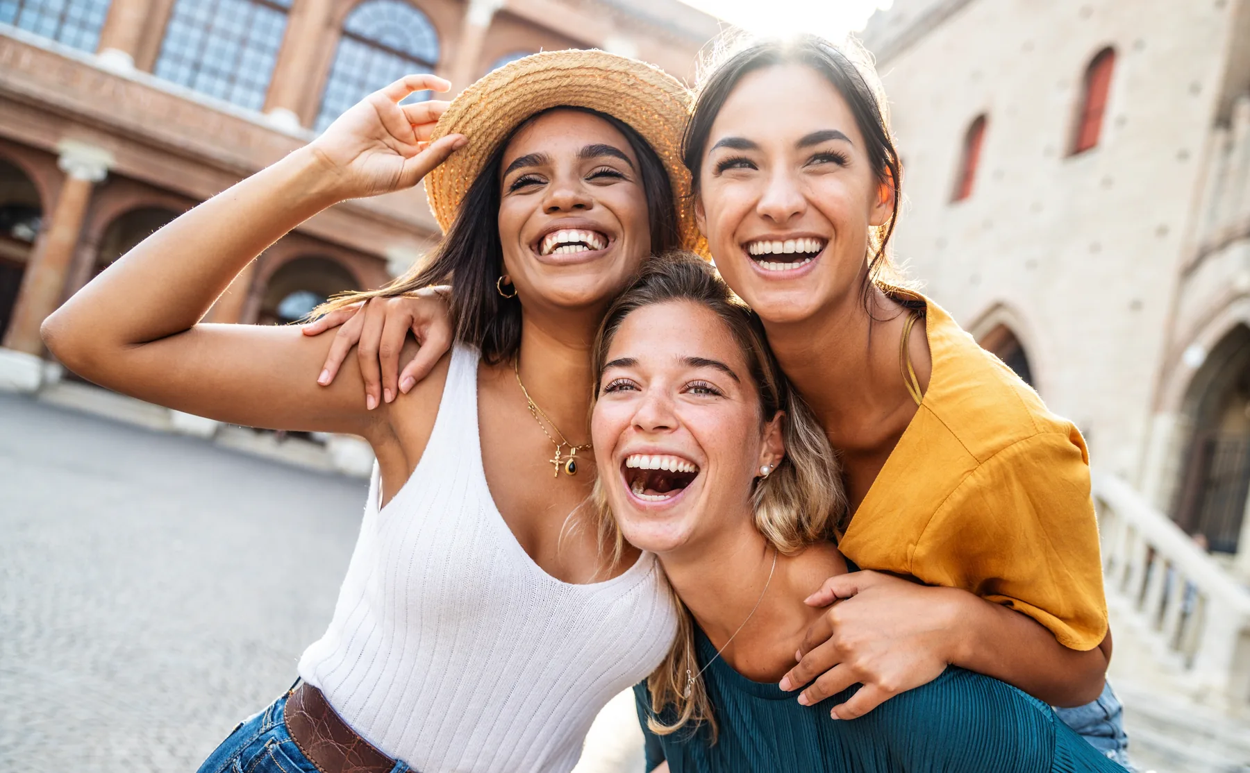 Smiling friends taking a selfie outdoors