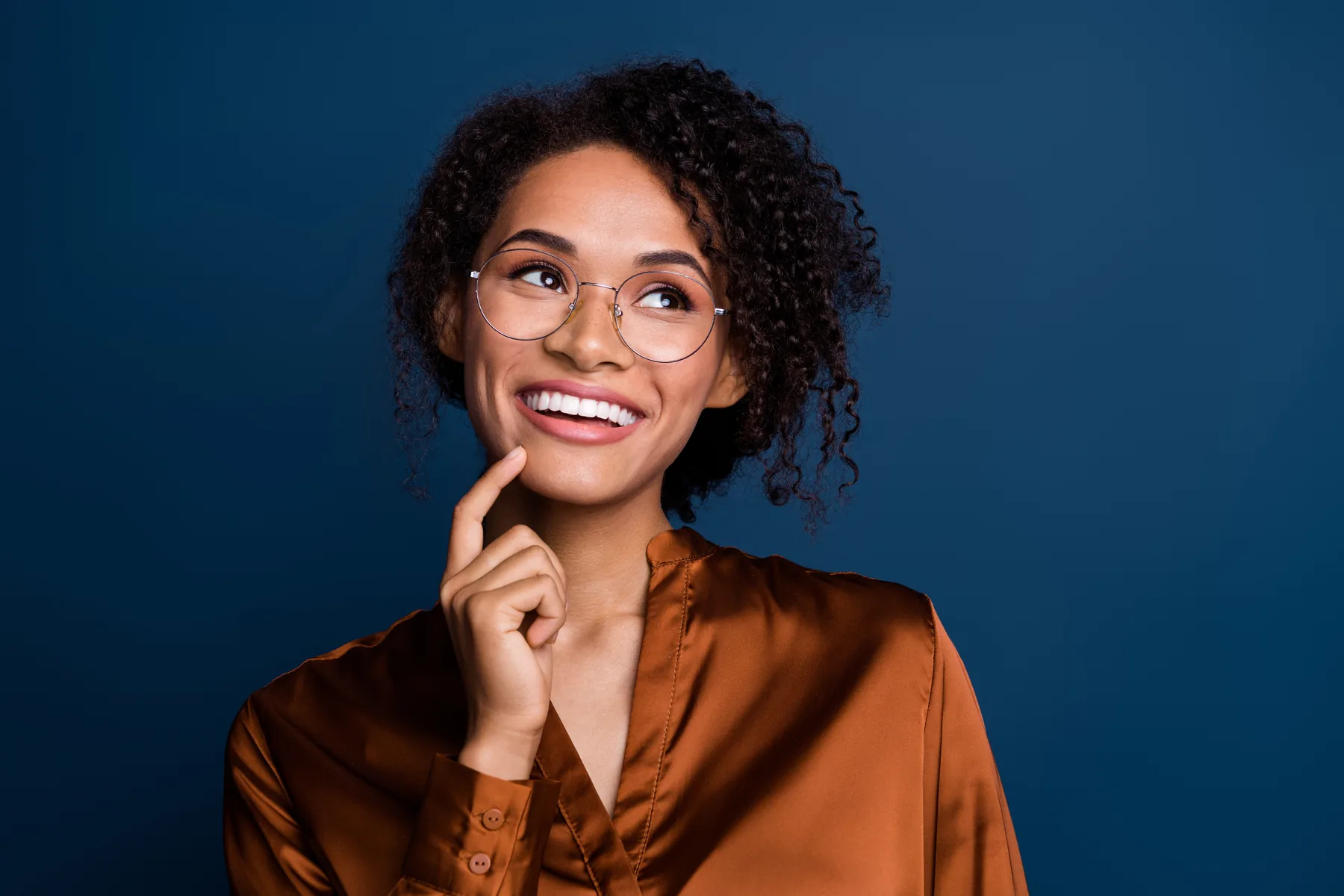 Smiling woman against a blue background