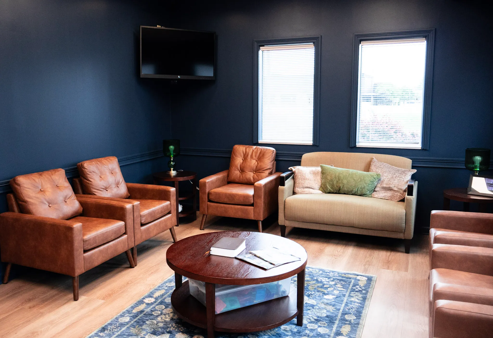 A dental office lobby with seating for patients