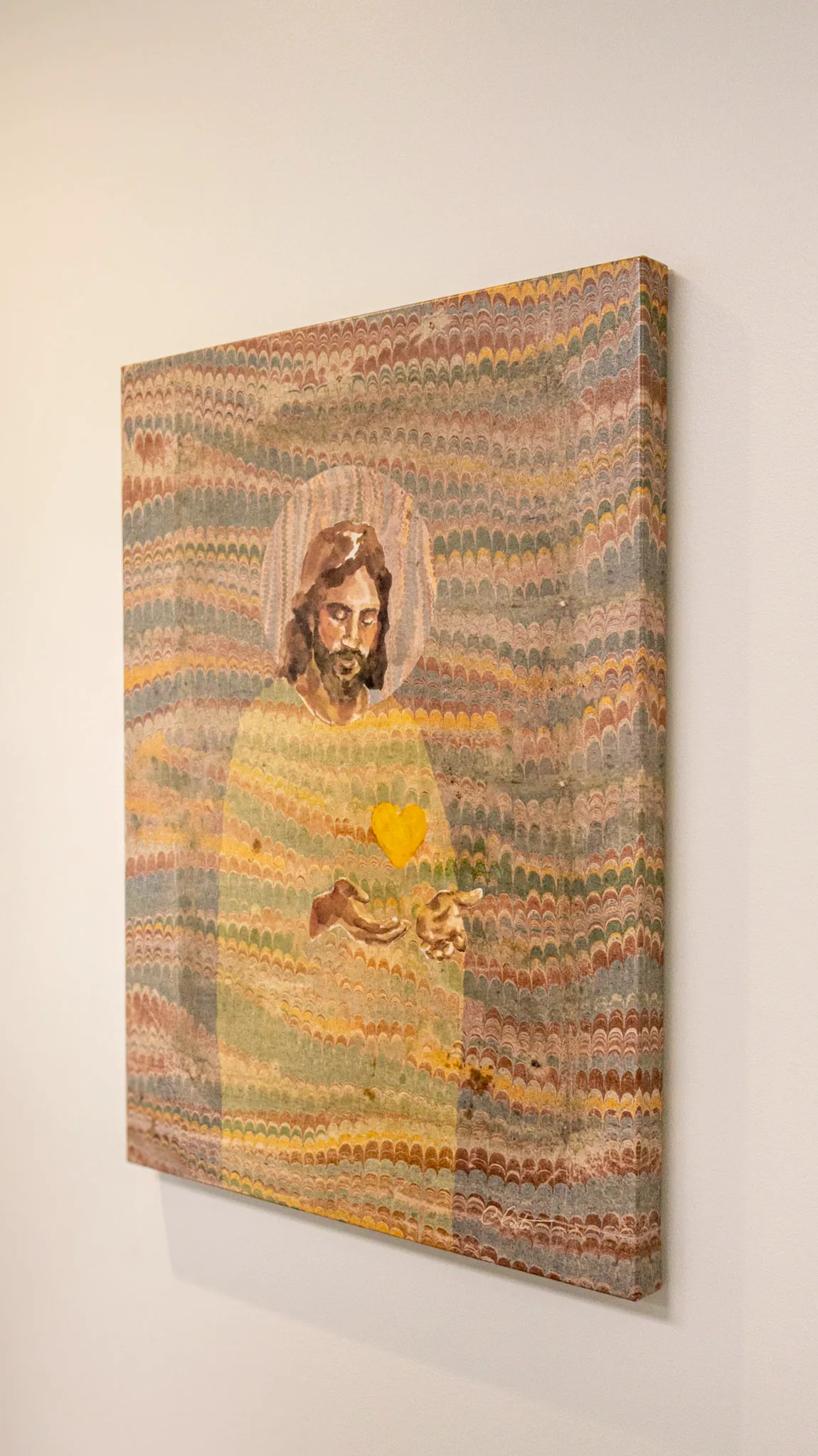 [Artwork hanging on an office wall]